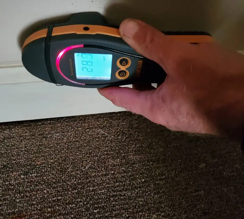 Moisture detection at baseboard during Storm Damage Restoration in Pelham